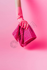 粉红色背景橡胶手套夹布中女清洁剂部图片