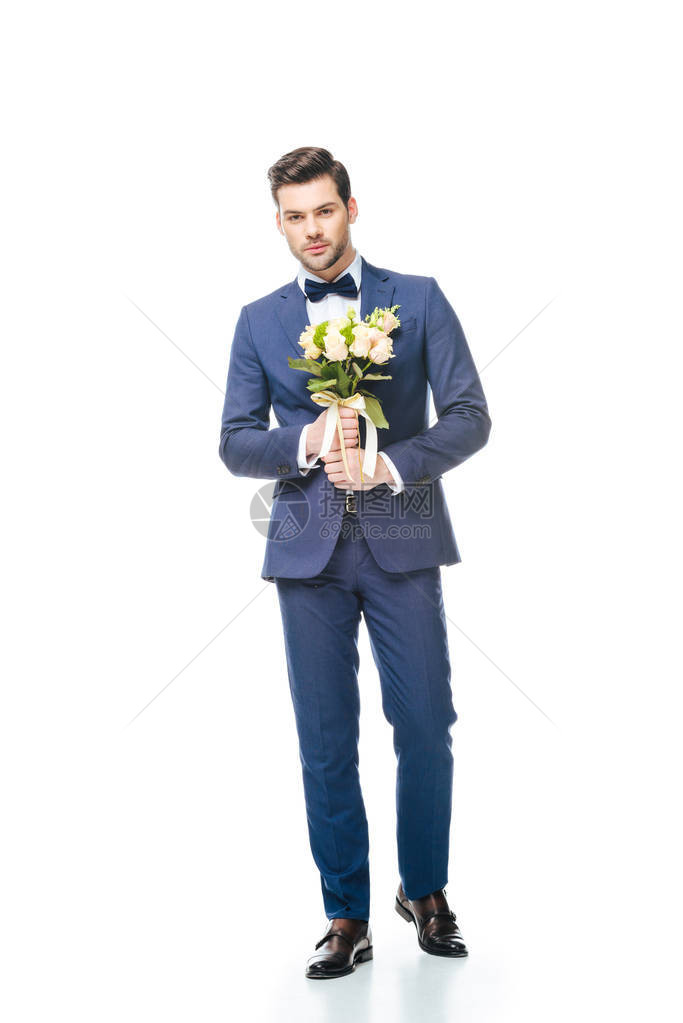 现代时装新郎婚礼花束握在白图片