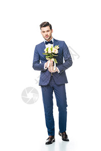 现代时装新郎婚礼花束握在白图片