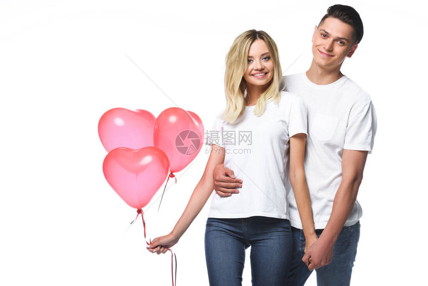 一对夫妇与一捆心形气球站在一起它们被图片