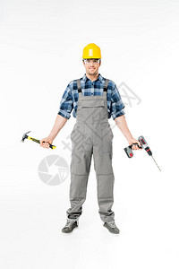 佩戴头盔和防护眼罩的男专业建筑工人图片