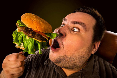 胖子吃快餐的不耐烦图片