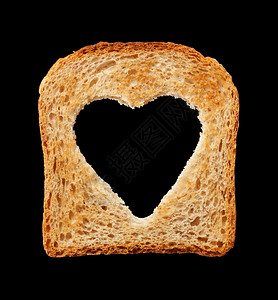 食品和健康概念带心形孔的面包图片