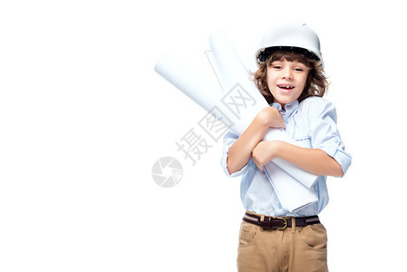 身着建筑师服装和头盔戴头盔的中学生男孩拥抱白图片