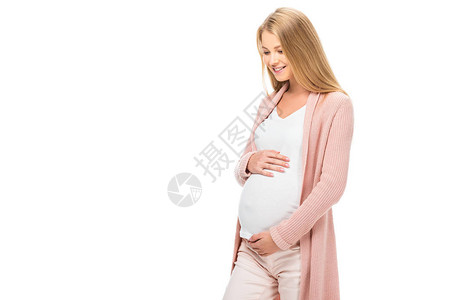 微笑着的孕妇抚摸肚子仰望着与图片