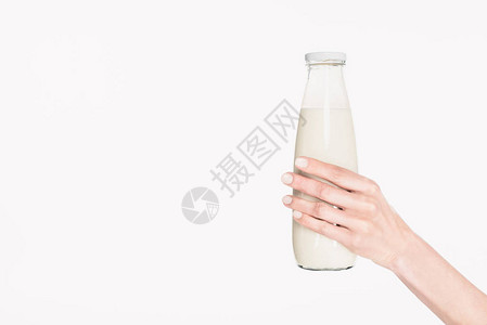 妇女用玻璃瓶奶水在白边隔离的图片