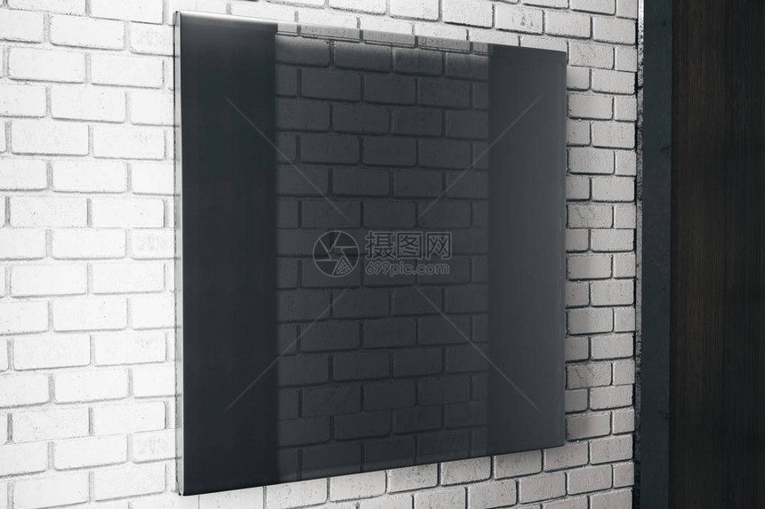砖墙背景上的正方黑玻璃板的侧面视图Ad概念图片