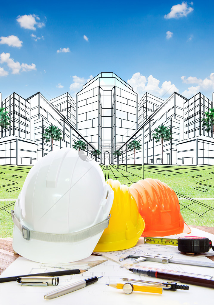 带书写工具安全帽的建筑师工作台和土地开发和房地产设计新建筑施图片