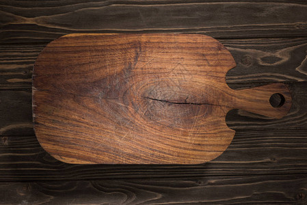 棕色桌子上木制切菜板的顶部视图背景图片