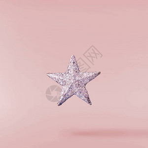 圣诞节的概念创意圣诞构想是在粉红色背景下坠入空中银星插画