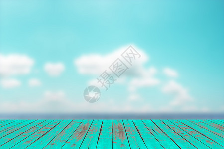 模糊的海滩背景上的木桌面图片