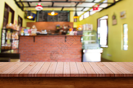 空木桌模糊的咖啡店背景用于显示或添图片