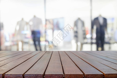 空的木桌空间平台和模糊的购物中心或购物中心背景图片