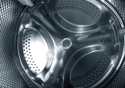 洗衣机金属圆形元件的特写照片图片