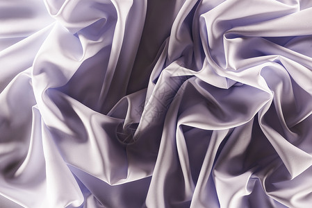 以折叠优雅的紫色丝绸面料为背景的全图片
