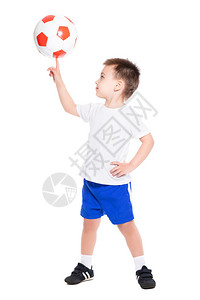 小足球运动员拿球在白背景的手指上被孤图片