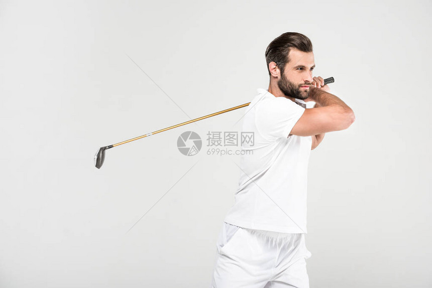 白色运动场的男高尔夫球员与高尔夫俱乐部穿白运动服图片