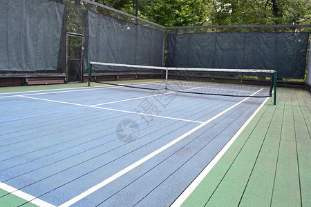 一个蓝绿平台网球场背景图片
