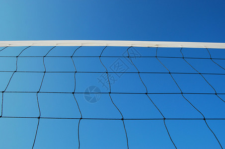 海滩蓝天空上的排球网图片