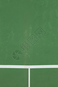 网球场的白线以绿色地板背景为背景图片