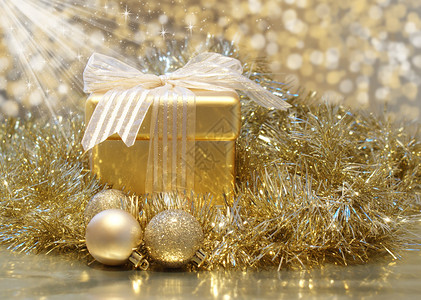 圣诞背景与金色礼物与闪发光的星背景图片