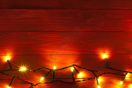 圣诞质朴背景复古的红色木板带灯光和图片