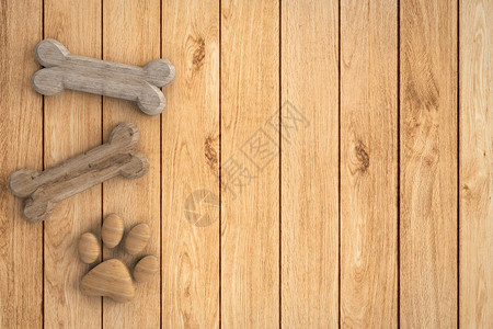 木制背景上的狗骨头和狗爪子图片