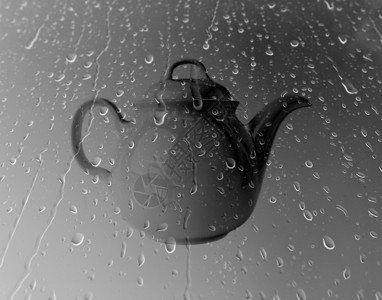 茶壶上水滴背景图片