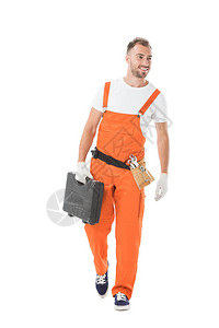 身着橙色制服的汽车机械师手持工具箱望图片