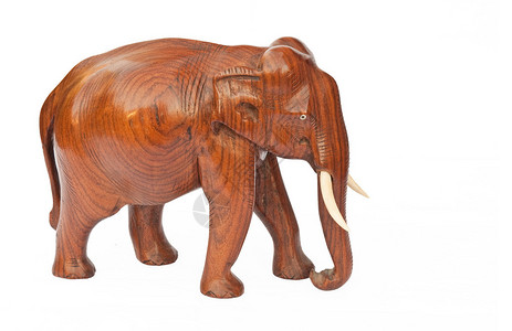 Wooden雕刻的大象在白色图片