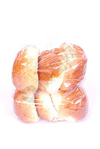 一个装满大面包的塑料袋图像在白色工作室背景图片