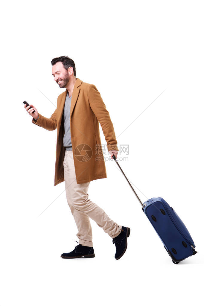 用手提箱和移动电话旅行的时装图片