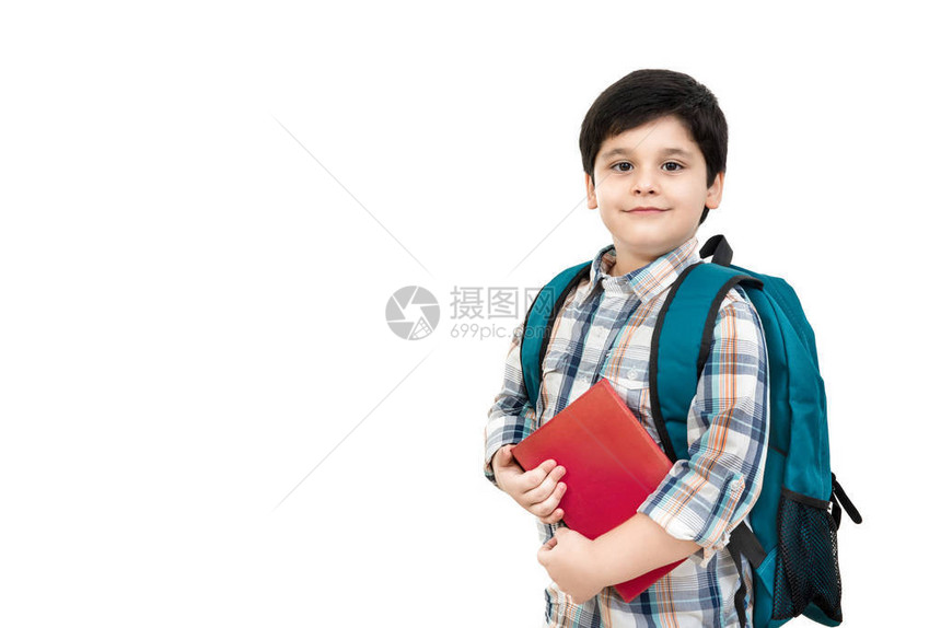 带着书包和手持书籍的亚洲可爱男孩在白色背景与复制空间上孤立无分回到学校和图片