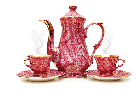 茶壶和杯子上白色孤立图片