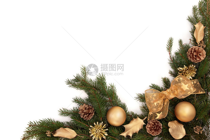 圣诞边框有金黄弓和霍利装饰品松果和葡萄叶图片