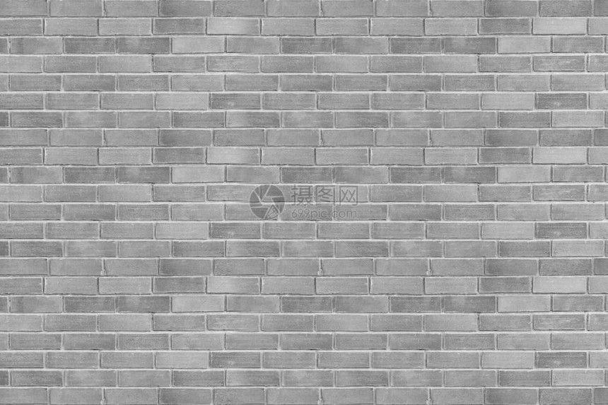 砖墙是背景或纹理用的石工技术的铁锈块彩色水平建筑壁图片
