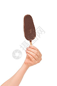 一个巧克力香草冰淇淋手握着图片