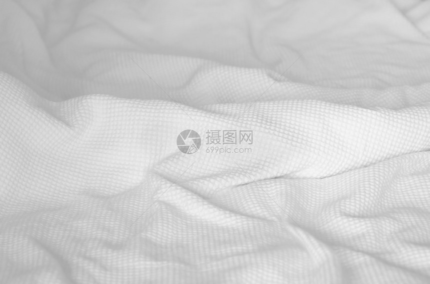 卧室床上的白色毯子抽象背景纹理图片