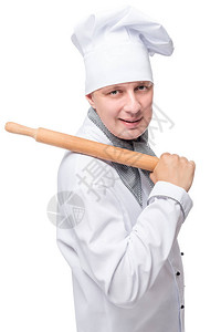 用擀面杖分离面团的厨师的垂直肖像图片
