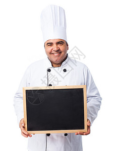 一个拿着黑板的厨师的肖像图片