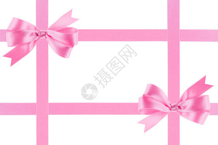 白色背景上有蝴蝶结的粉红丝带图片