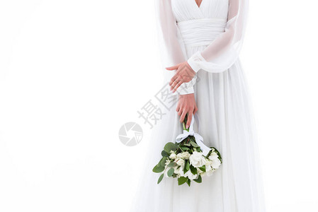 穿着优雅礼服和婚礼花束的新娘图片
