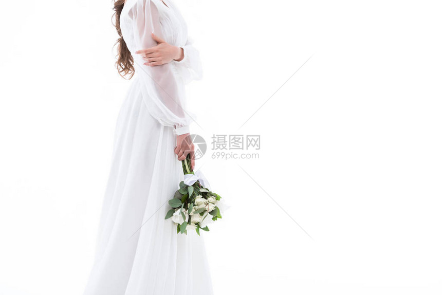 以传统礼服和婚纱花束的新娘图片