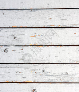 旧的白漆木衬板墙风化漆木板的白色背景图片