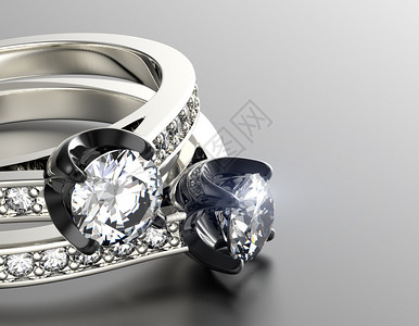 灰色背景上镶有钻石的珠宝戒指图片