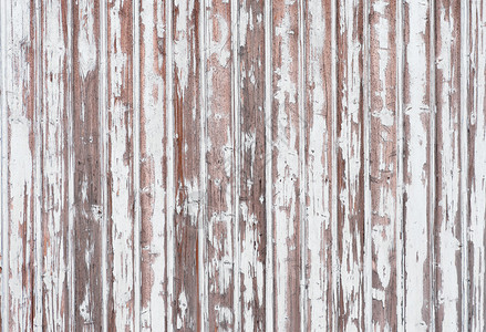 剥落白漆的木墙背景图片