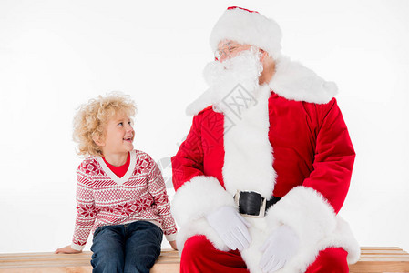 圣诞老人和孩子坐在长椅上的孩子背景图片