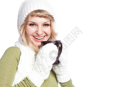 一位带着咖啡杯的快乐美丽的天主教女冬图片