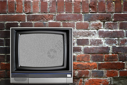 老式电视和砖墙图片