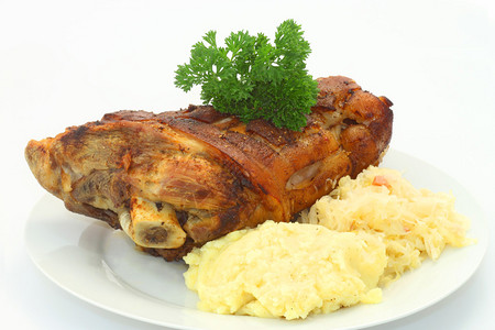 巴伐利亚烤猪叉肉和酸菜以及土豆图片